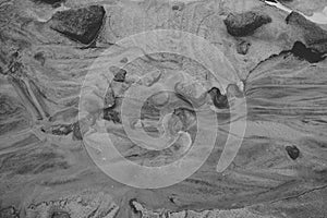 black and white picture of sand with water marks