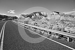 Black and white picture of a scenic road.