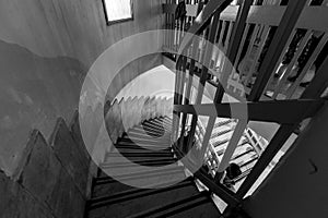 A black and white picture of a stairs with one person