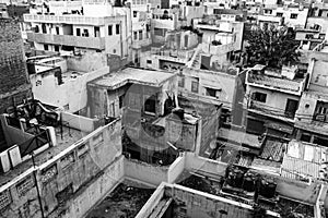 Black and white picture of urban decay and view of roofs in delhi