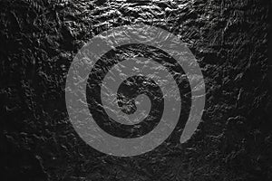 Black and white plasticine texture on a modeling board