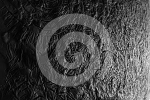 Black and white plasticine texture on a modeling board