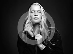 black and white portrait of beautiful blond woman in hood
