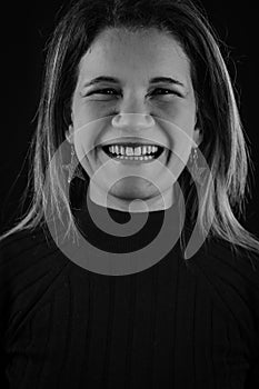 black and white portrait of a beautiful blonde woman laughing cheerfully spontaneously and honestly