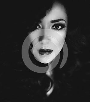 Black and white portrait of a beautiful woman with dark hair