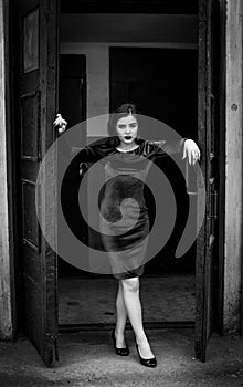 Black and white portrait of beautiful young brunette woman with bright makeup