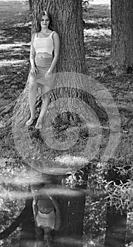 Black and white portrait of stunning young woman in park