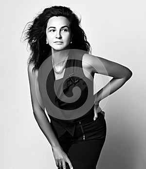 Black and white portrait of brunette business woman in trendy formal suit. Gorgeous female model Front view