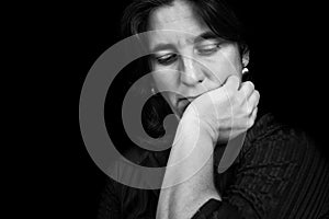 Black and white portrait of a depressed hispanic woman