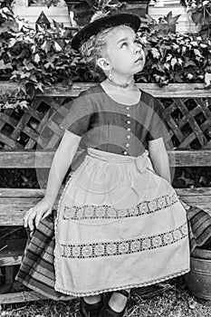 Black and white portrait of a girl in a dirndl