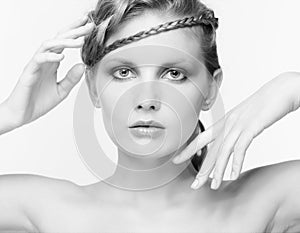 Black and white portrait in high key tone female with creative hairdo braids