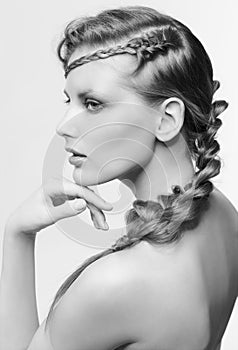 Black and white portrait in high key tone female with creative hairdo braids