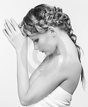 Black and white portrait in high key tone female with creative hairdo braids