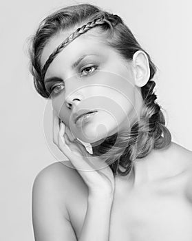 Black and white portrait in high key tone female with creative hairdo braids