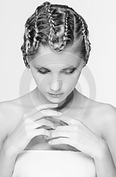 Black and white portrait in high key tone female with creative hairdo braids