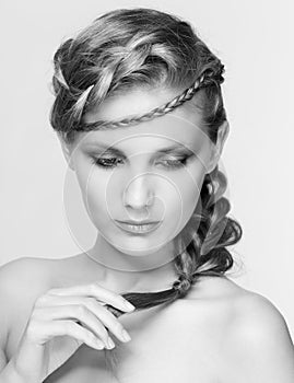 Black and white portrait in high key tone female with creative hairdo braids