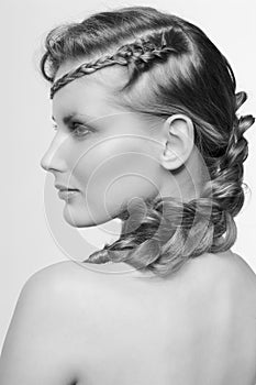 Black and white portrait in high key tone female with creative hairdo braids