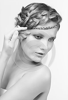 Black and white portrait in high key tone female with creative hairdo braids