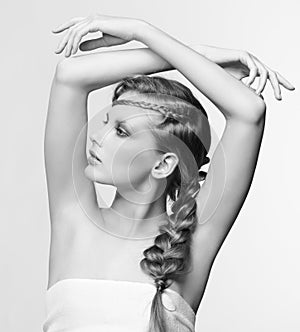 Black and white portrait in high key tone female with creative hairdo braids