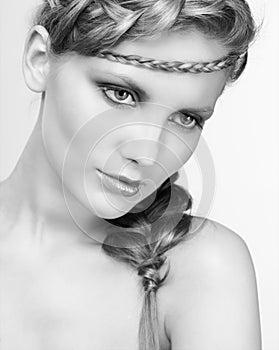 Black and white portrait in high key tone female with creative hairdo braids