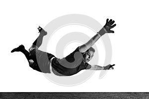 Black and white portrait of male soccer football goalkeeper psoing isolated over white background. Monochrome. Concept