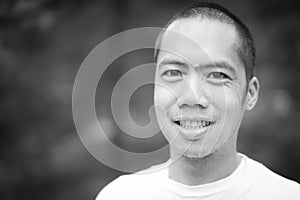 Black and white portrait of middle aged Asian male