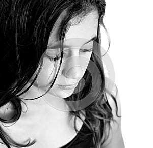 Black and white portrait of a sad hispanic girl