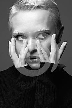 black and white portrait of Short Hair Beautiful young woman with white snow brows