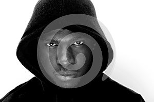 Black and white portrait of young black man with hoodie