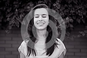 Black and white portrait of young brunette woman