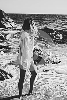 Black and white portraits of a young woman on the beach