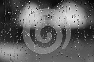 Black and White Raindrops on Window Glass