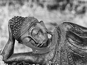 Black and white reclining Buddha ornament on sale in market, Myanmar