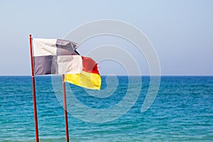 Information flags on the sea beach
