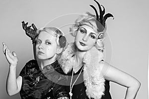 Black and white retro portrait of two girls-blondes