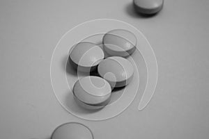 Black and white round medical pharmaceutical drugs for the treatment of diseases and the killing of microbes and