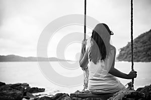 Black and white of Sad and lonely woman sitting alone