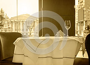 Black and white sepia tonned photo of a restaurant table