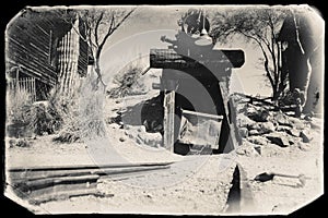 Black and White Sepia Vintage Photo of Goldfield Gold Mine old entrance to gold mine shaft with trolley