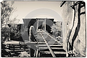 Black and White Sepia Vintage Photo of Goldfield Gold Mine`s old dangerous entrance to a gold mine