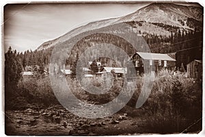 Black and White Sepia Vintage Photo of Old Western Wooden Buildings in St. Elmo Gold Mine Ghost Town in Colorado