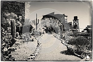 Black and White Sepia Vintage Photo of Old Western Wooden Bulding in Goldfield Gold Mine Ghost Town in Youngsberg