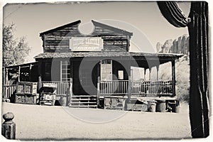 Black and White Sepia Vintage Photo of Old Western Wooden Bulding in Goldfield Gold Mine Ghost Town in Youngsberg photo