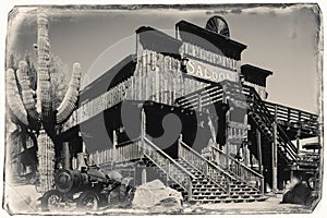 Black and White Sepia Vintage Photo of Old Wild Western Wooden Saloon in Goldfield Gold Mine Ghost Town