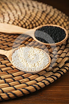 Black and white sesame seeds on wicker mat