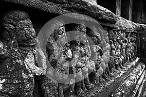 Black and white shot of dancing ganas sculptures with selective focus at Badami photo