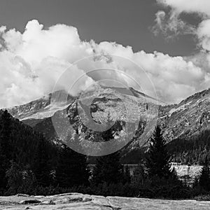 Black and white shot of a rocky mountain Val di Fumo in Trentino, Italy photo