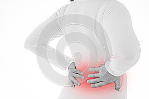 Black and white shot of woman feeling exhausted and suffering from waist and back pain and injury on  white background