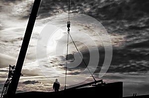 Black and white silhouette of a steelworker