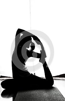 Black and white silhouette yoga woman in Absara pose